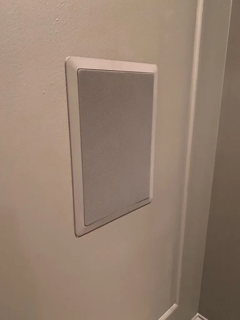 Polk in-wall surround speakers with painted grill