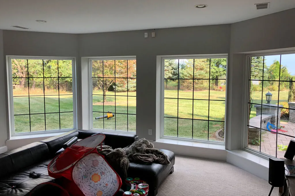 The basement windows with black grilles.