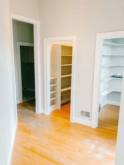 The original configuration of the pantry. Two closets with shelving.