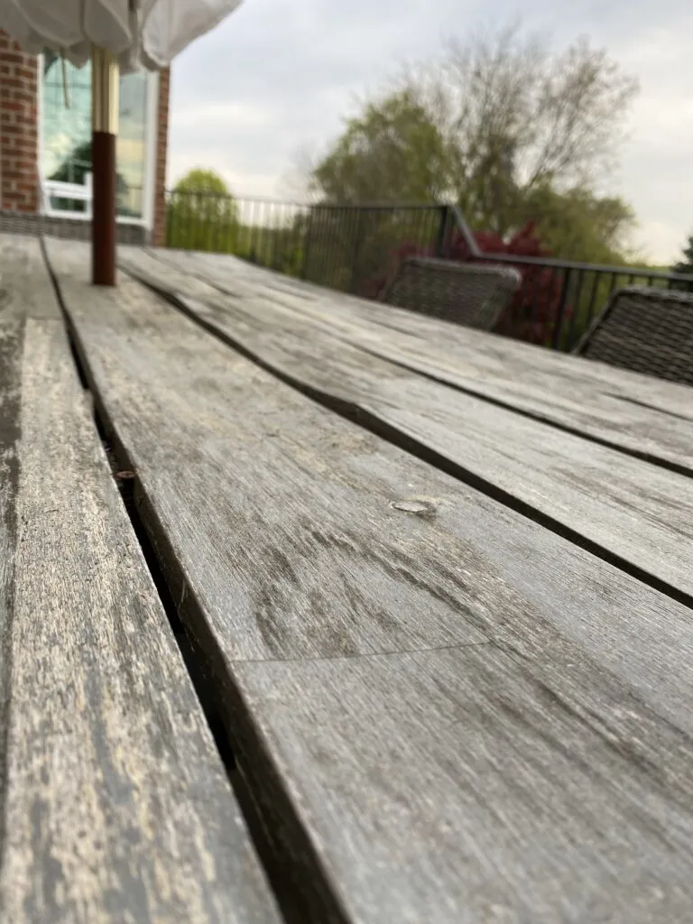 Warped wood, chipping paint, and splinters galore. Time for a new outdoor table!