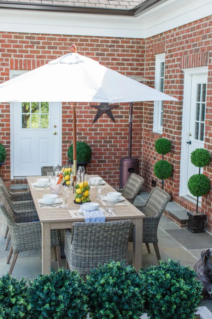 The large scale of this faux teak table works perfectly in our outdoor space!