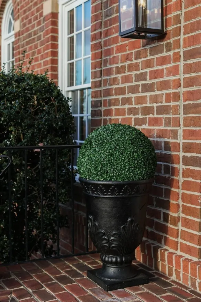 Faux outdoor plants on front porch