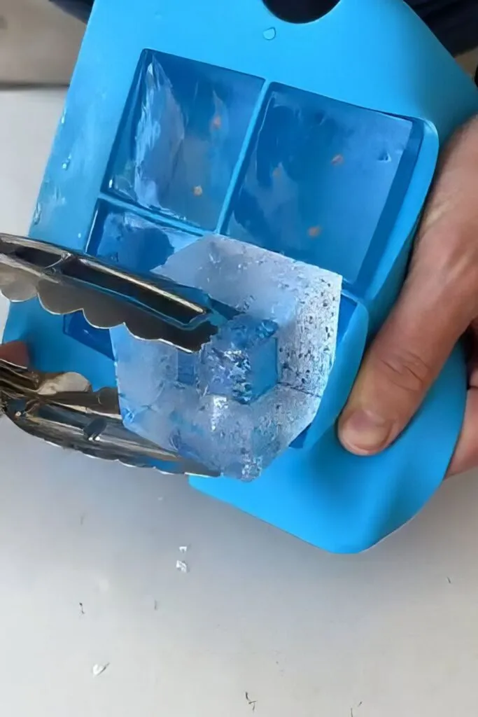 Remove the Clear Ice Cube with Tongs