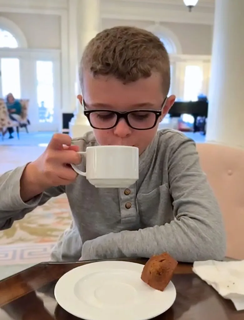 Tristan enjoying Hot Cider at Social Hour in the Lobby