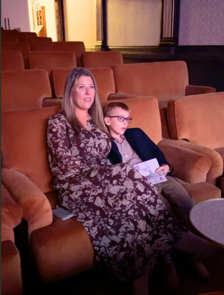 Watching Coco in the plush seating inside Theater 1923