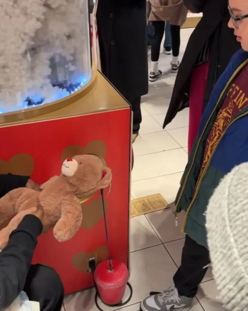 Tristan operating the stuffing machine at Build A Bear in FAO Schwarz