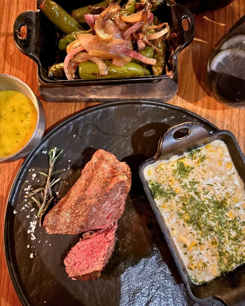 The sirloin filet, creamed corn, and sauteed onions, mushrooms, and jalapenos.