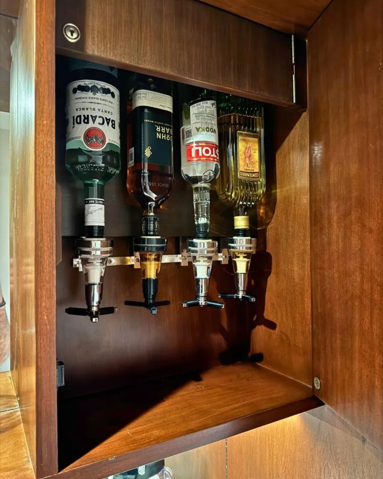 Tucked in the upper cabinet by the bar in our room - an alcohol dispenser!