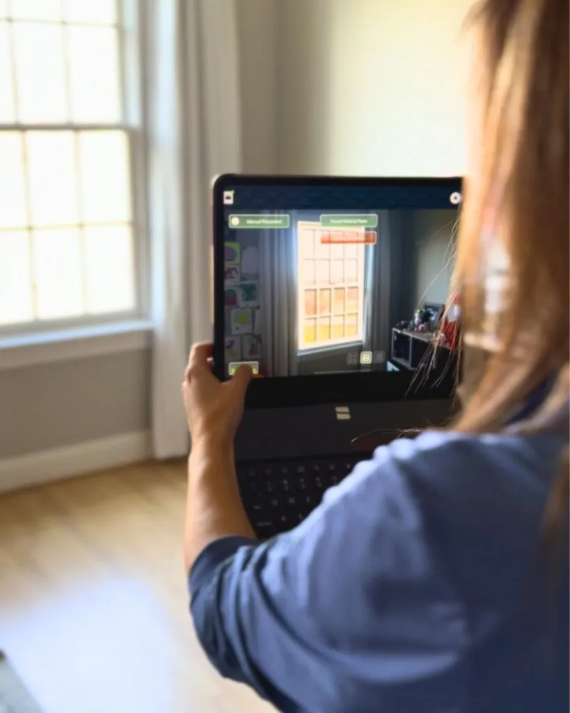 Our Renewal by Andersen representative, Mary, showed us AR previews of our windows using her laptop.
